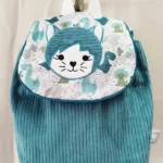 Velours côtelé vert dinosaures